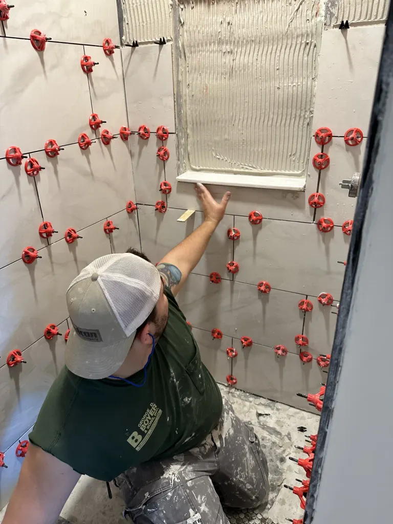 Bathroom tile installation in progress.