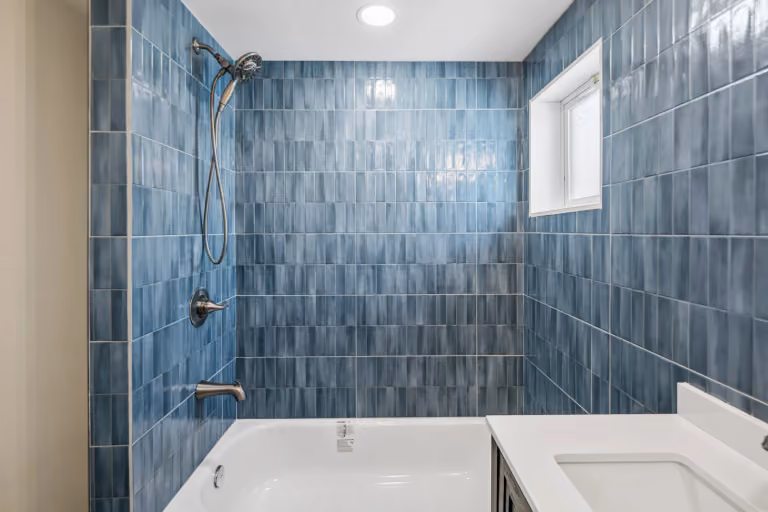 The blue-tile tub bathroom