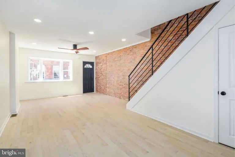 Finished Gerritt Street interior with new stair railings and living space.