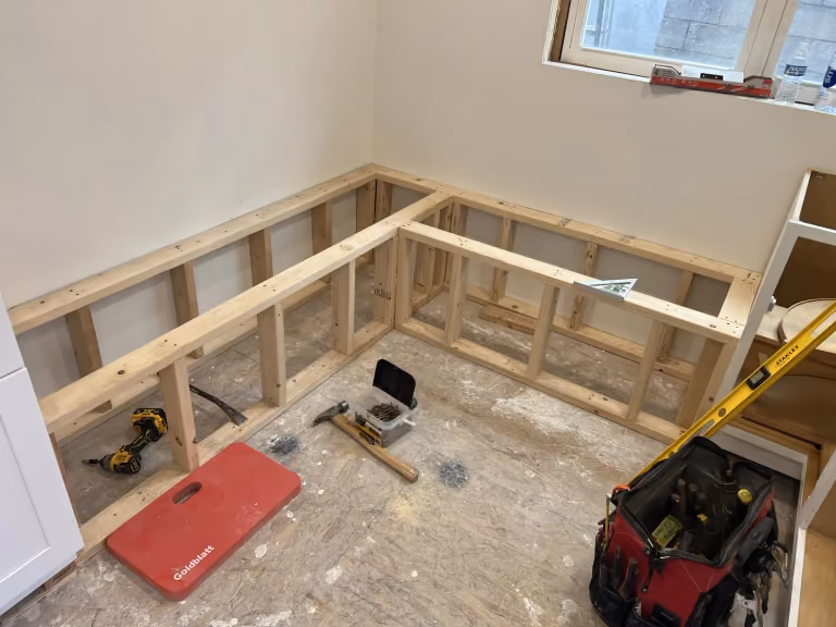 Framing the L-shaped breakfast-nook bench.