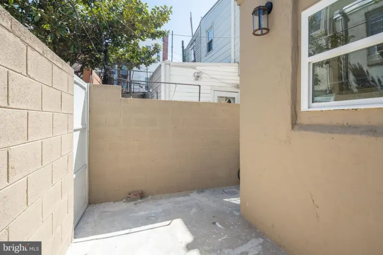 6xx Gerritt St — finished rear exterior / patio.