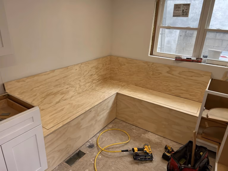 The bench takes shape with its plywood seat and back.