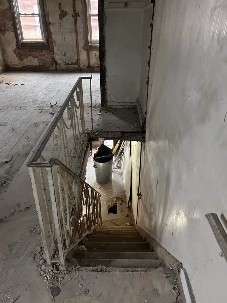 The original staircase before new treads and railings.