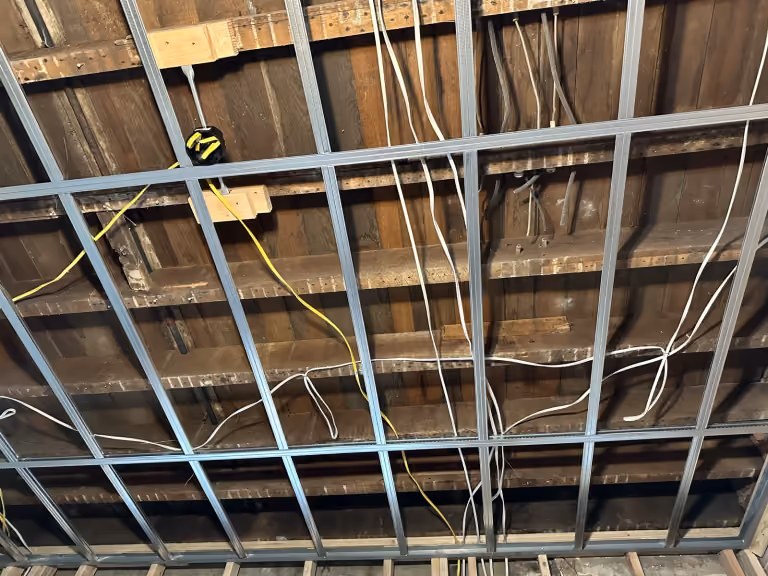 Electrical runs above the new ceiling framing.