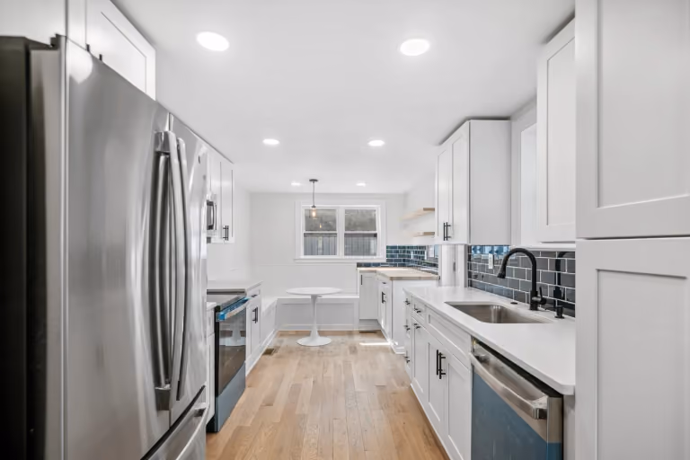 Kitchen cabinetry, worktops, and breakfast nook