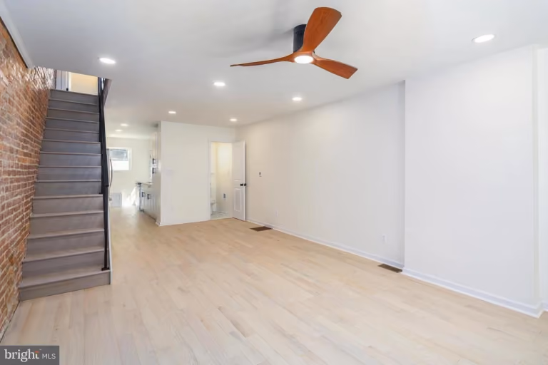 6xx Gerritt St — finished living room / stairs.