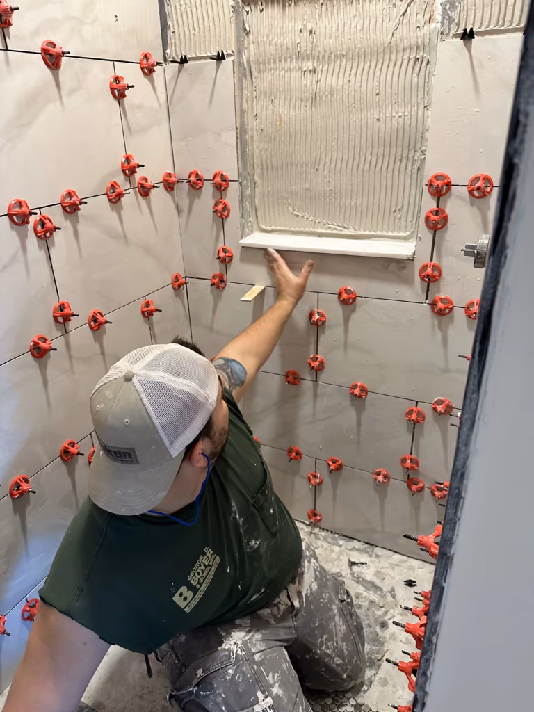 Bathroom tile installation in progress.