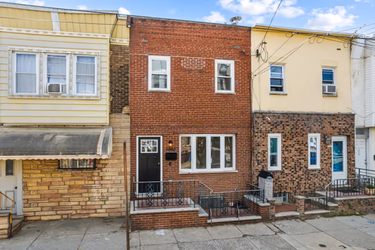 Final listing photograph: front brick facade.