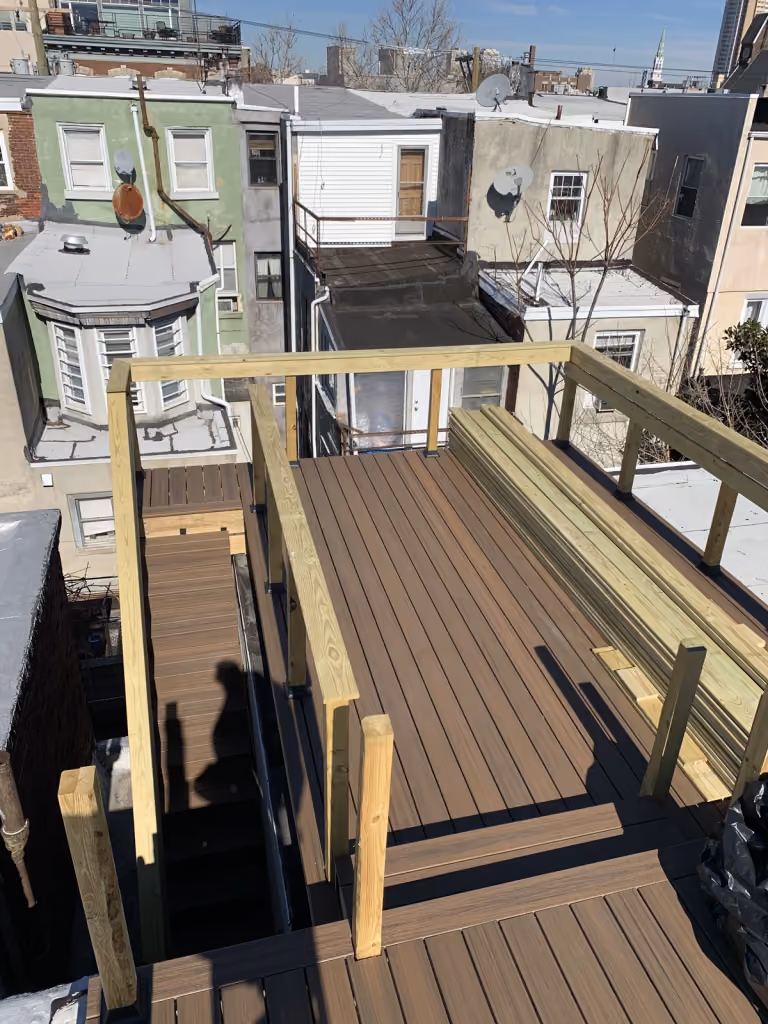 Deck boards installed across the rooftop.