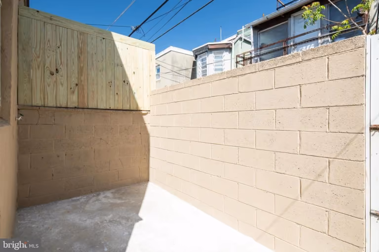 6xx Gerritt St — finished rear exterior / patio.